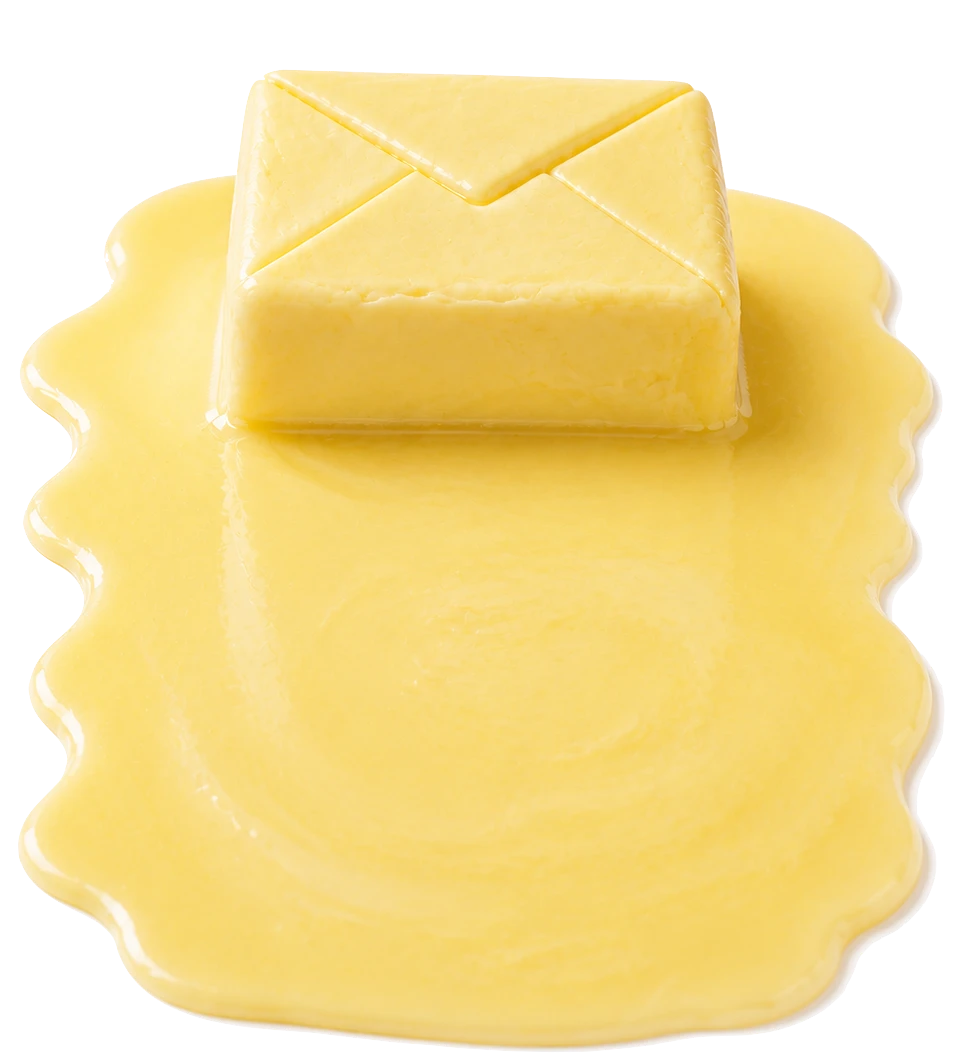An envelope carved out of butter, melting into a pool of butter