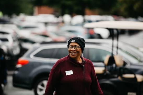 Welcome team volunteer in the parking lot